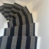 Greta GR02 Black flatweave stair runner on white wooden staircase