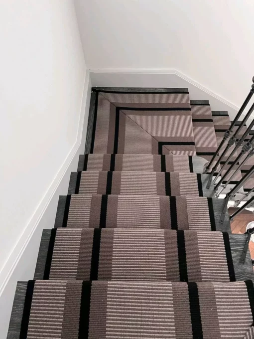 PNT21 flatweave stair runner on dark staircase