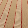 Close-up of striped Greta Sisal stair runner
